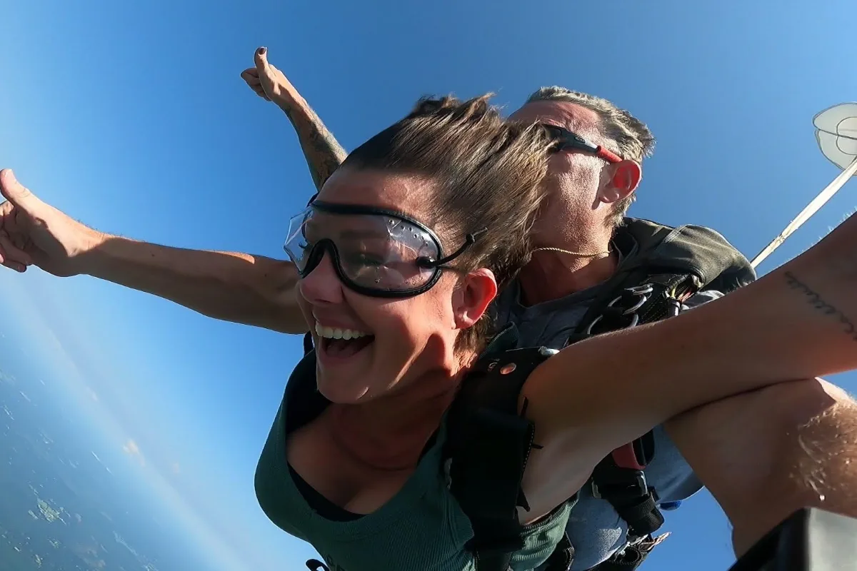 Tandem student and instructor in freefall over the Louisiana landscape